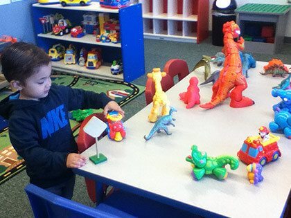 Boy with dinosaurs; Suffolk County Children's Center