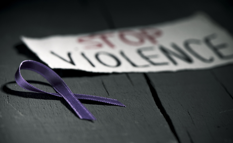 A purple ribbon signifying domestic violence awareness month