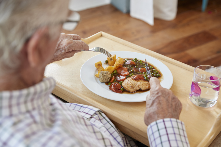 Meals on Wheels recipient eats a nutritious meal.