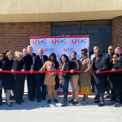 eac network cutting ribbon at ceremony