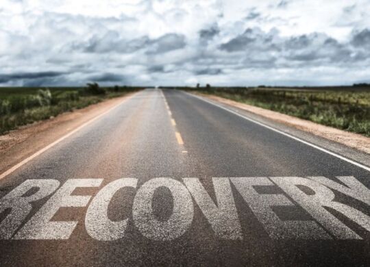 recovery written on a road