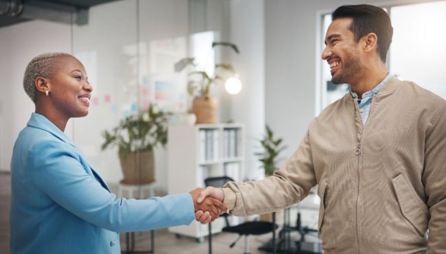 boss shaking hands with employee