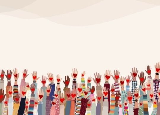 artwork showing dozens of arms raised inthe air, each with a heart in hand and depicting many different races