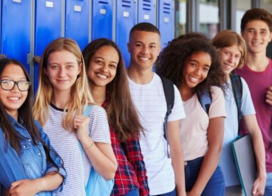 kids standing in front of a set of school lockers