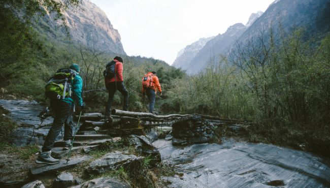 three people hiking in cold weather